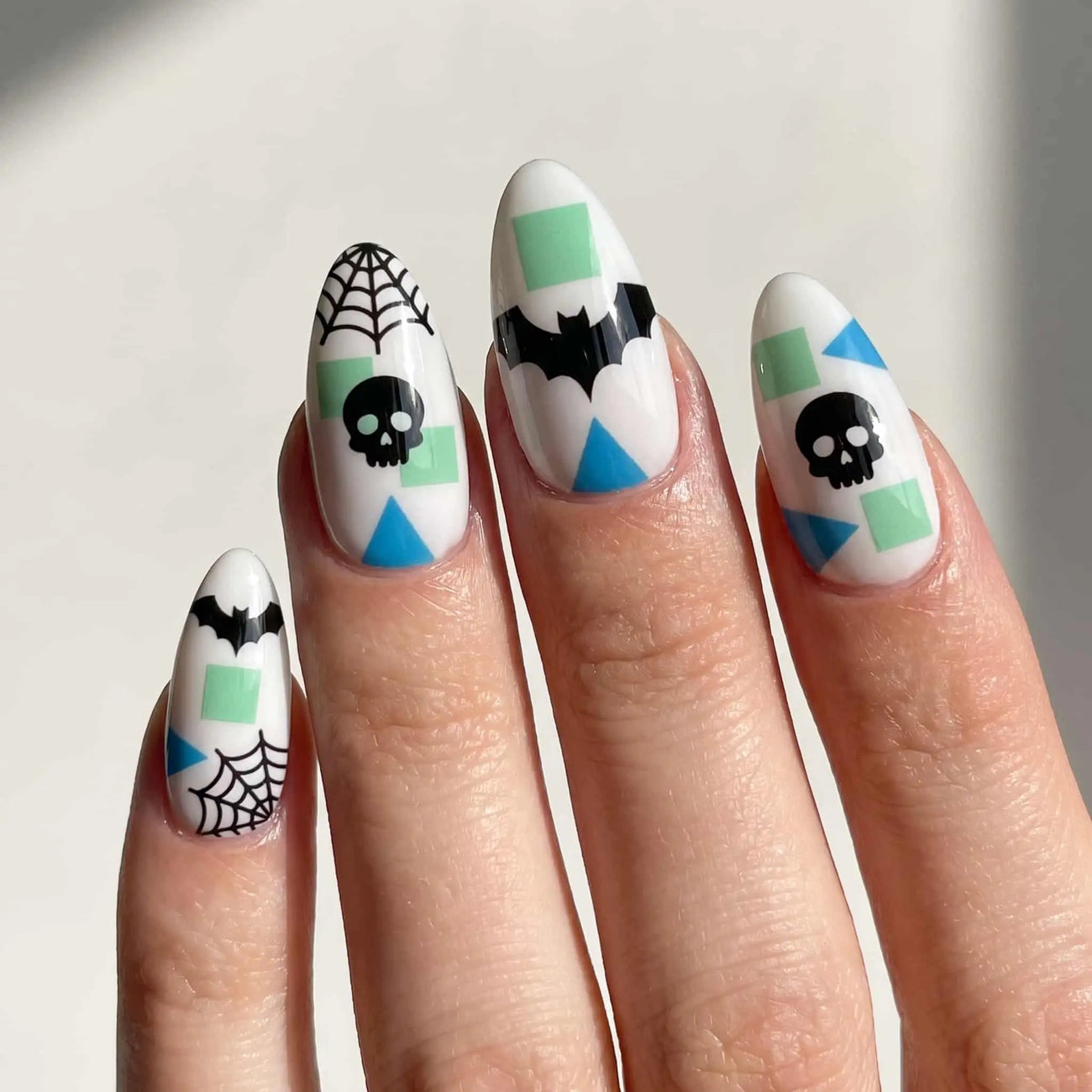 halloween almond press on nails worn look, mint geometric skull and bat