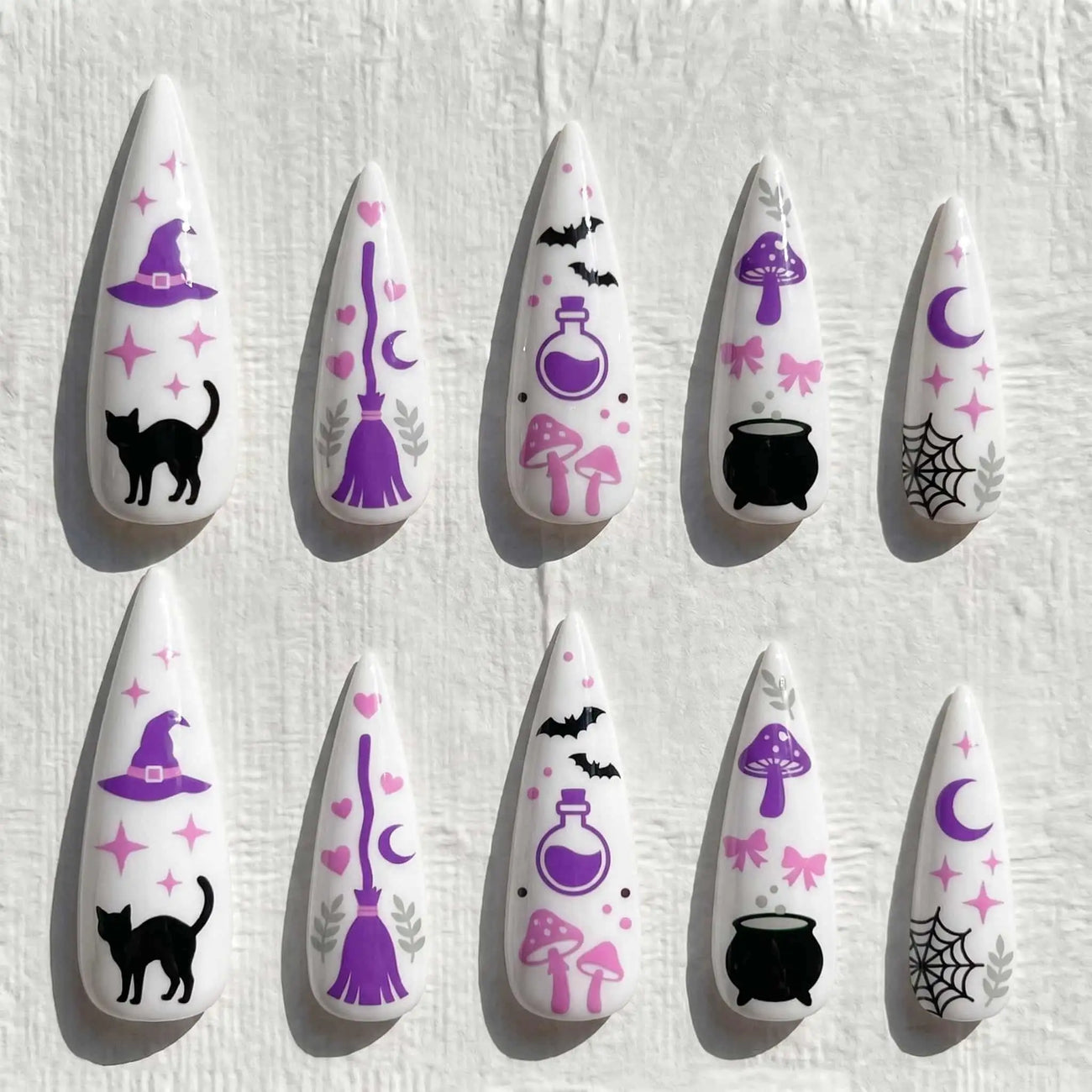 pink witch, black cat, potion, and moon halloween stiletto press on nails — spooky season design