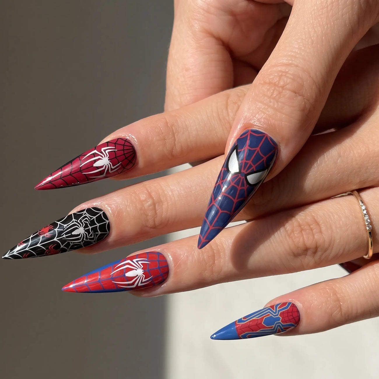 long glossy anime stiletto press on nails worn look, red blue web art
