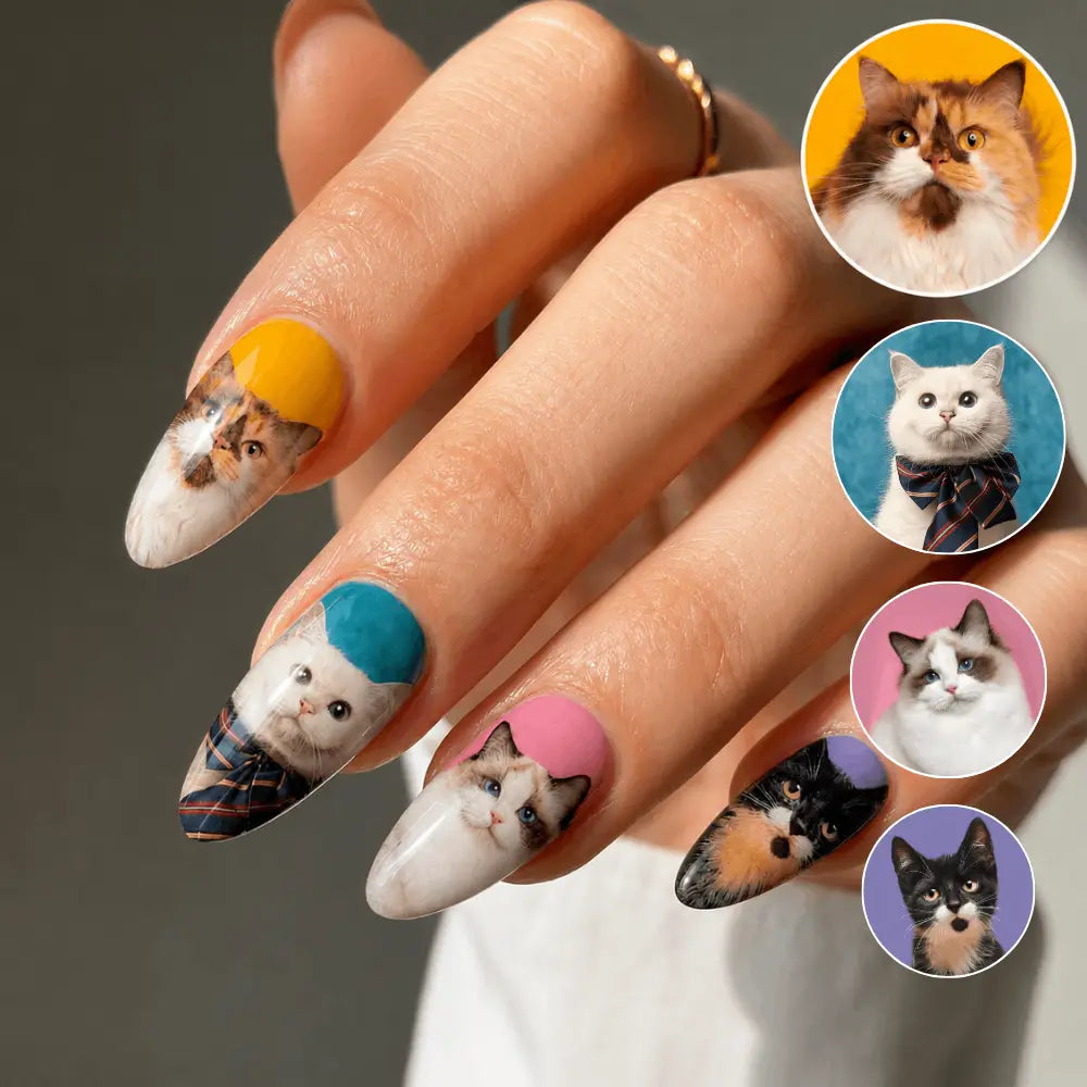 Custom cat portrait press-on nails shown on a hand with the source pet photos.