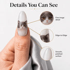 Close-up of high-definition cat portrait printing on a custom press-on nail.