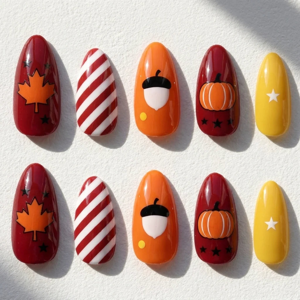 Harvest Glow short almond press-on nails — pumpkin, acorn, maple leaf, stripes, and autumn color