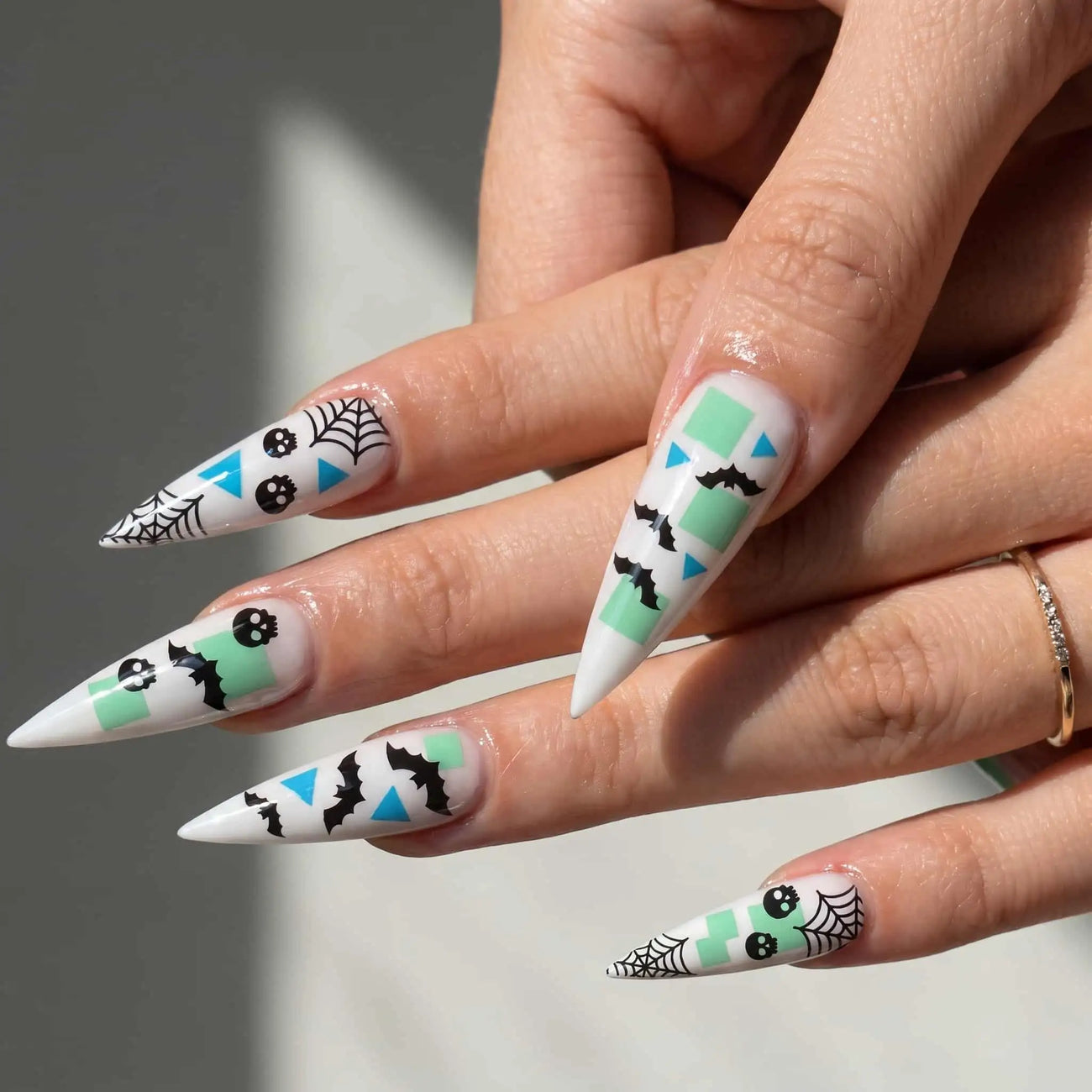 mint bats, skulls, and spider webs halloween press on nails detail, handmade glossy finish