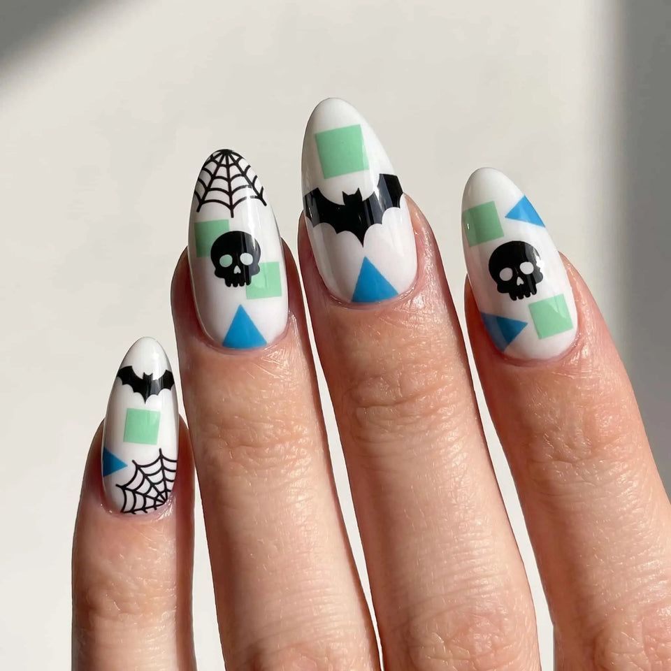 halloween almond press on nails worn look, mint geometric skull and bat