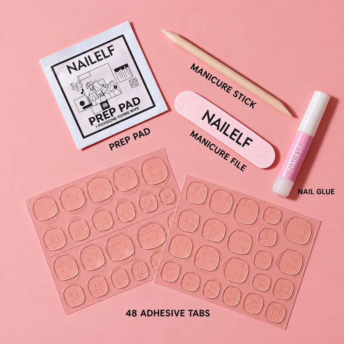 nailelf accessory kit included with preppy badge nails — nail glue, prep pad, manicure stick, nail file and adhesive tabs