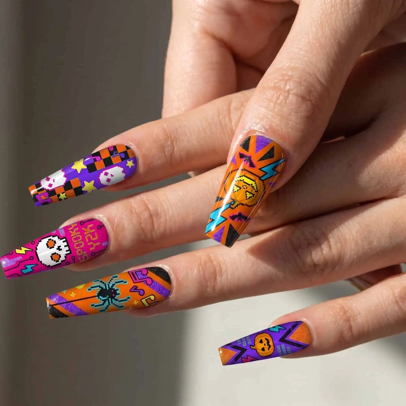 halloween coffin press on nails worn look, neon pumpkins, skulls, spiders, and lightning