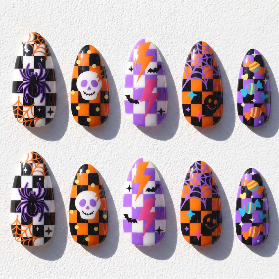 orange and purple patchwork with skulls and spider webs halloween almond press on nails — spooky season design