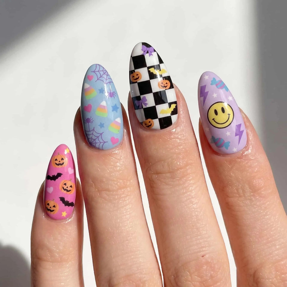 halloween almond press on nails worn look, pastel ghost and pumpkin design