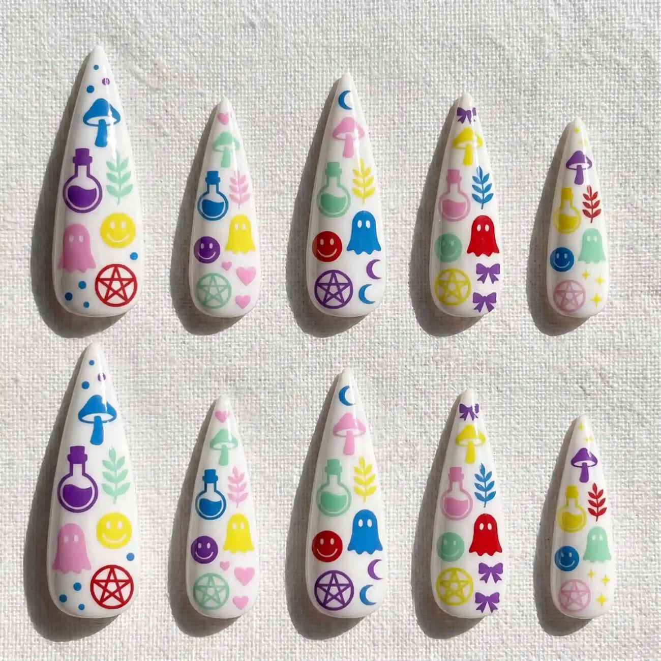 pastel potions, ghosts, mushrooms, and pentagrams halloween stiletto press on nails — spooky season design