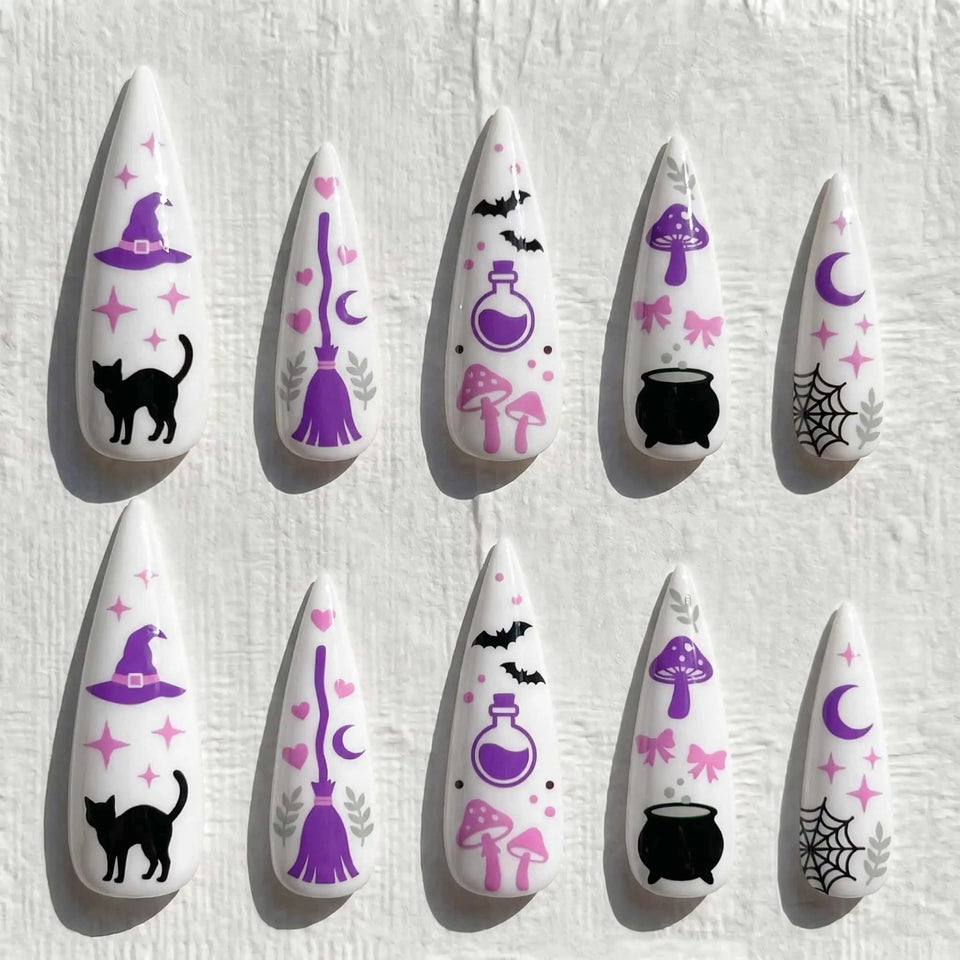 pink witch, black cat, potion, and moon halloween stiletto press on nails — spooky season design
