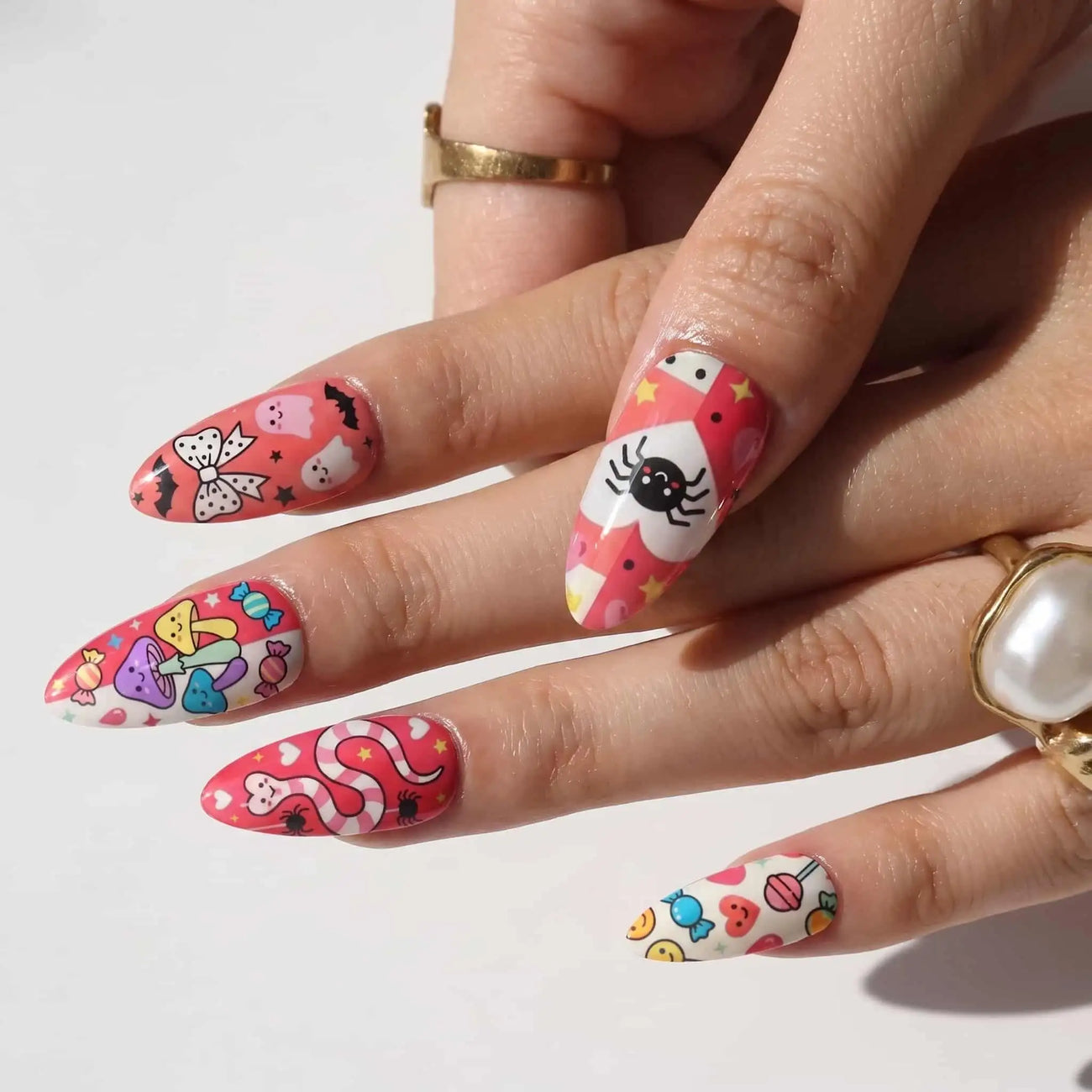 halloween almond press on nails worn look, red spooky characters, bows, and spiders