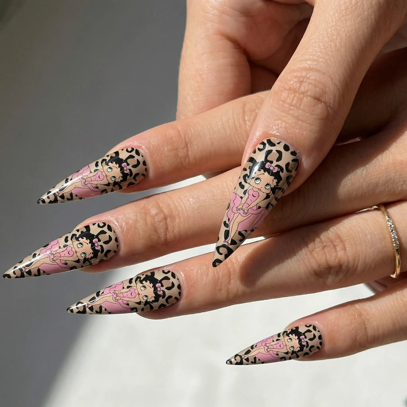 long glossy anime stiletto press on nails worn look, retro leopard art