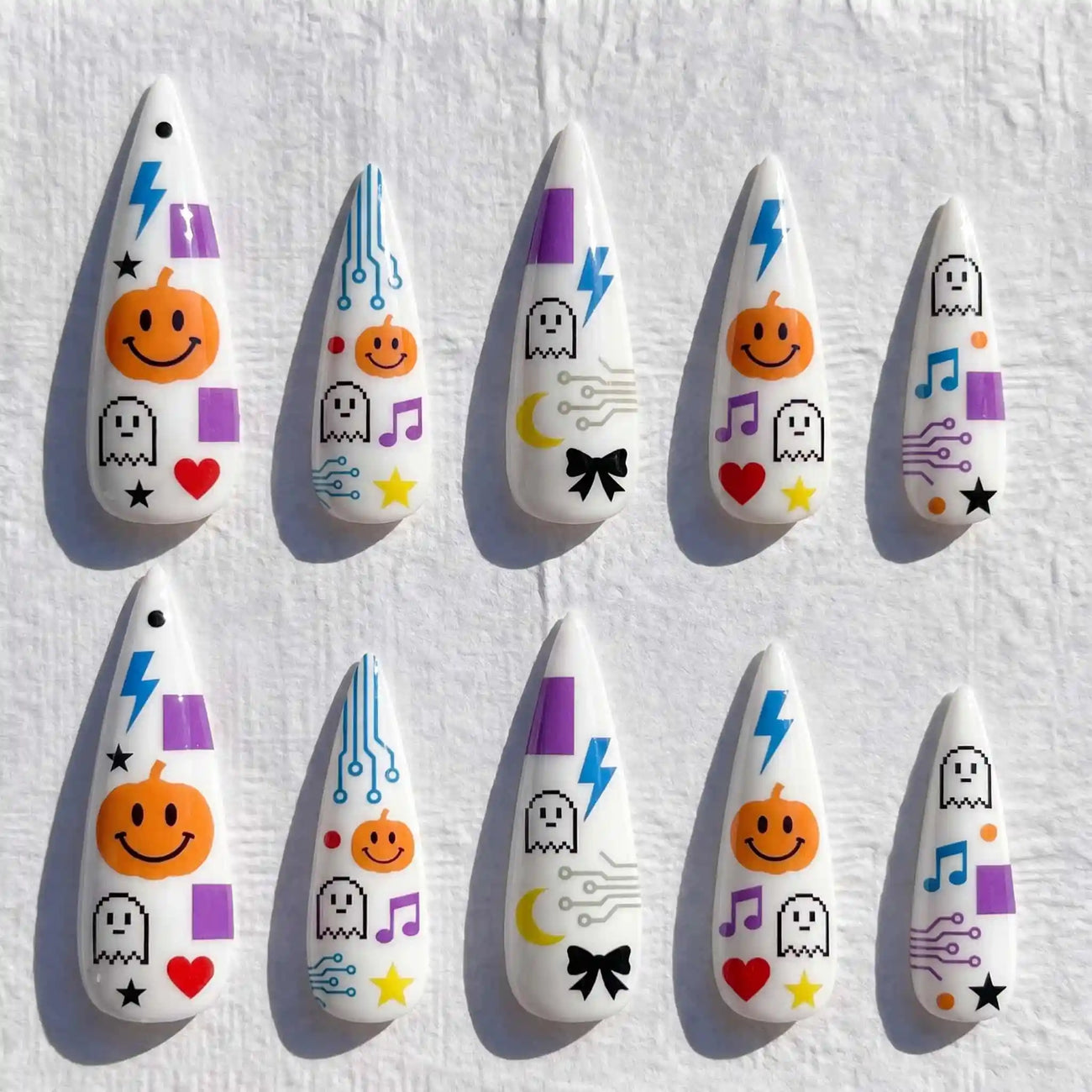 retro ghosts, pumpkins, and lightning bolts halloween stiletto press on nails — spooky season design