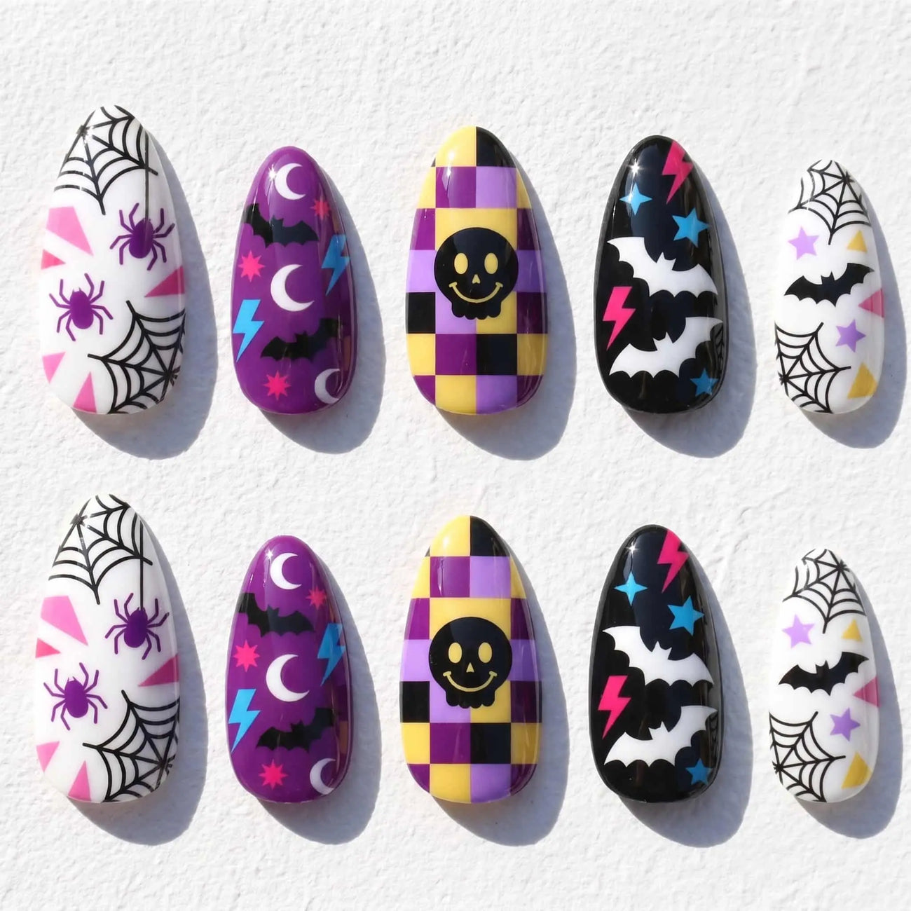 smiley face and spider web halloween almond press on nails — spooky season design