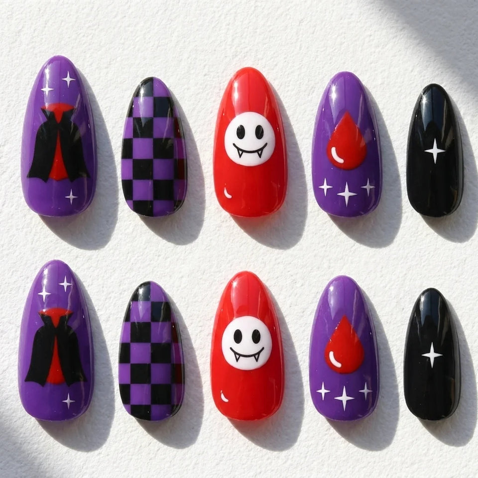 Vampire Pop short almond press-on nails — vampire cape, fangs, red drop, and checkerboard art