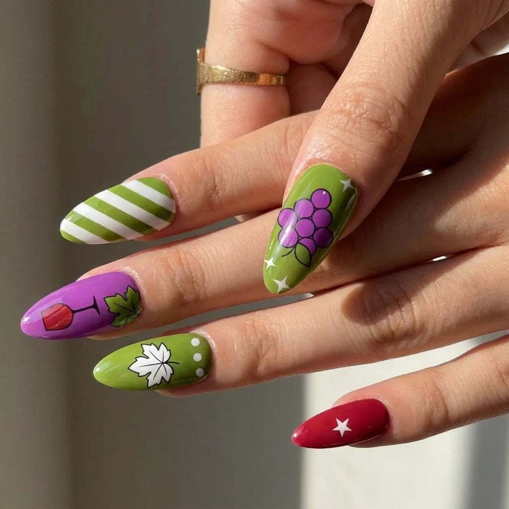 Vineyard Mix short almond press-on nail art detail — grape, wine glass, maple leaf, and striped art